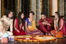 couples celebrating diwali and decorating home