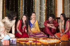 couples celebrating diwali and decorating home
