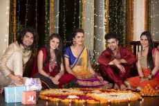 couples celebrating diwali and decorating home