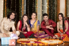 couples celebrating diwali and decorating home