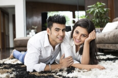 couple lying on floor and posing for the camera