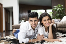 couple at home posing for the camera