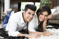 couple smiling and having leisure time at home