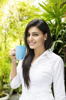 smiling young woman woman having a beverage
