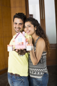 couple posing with home miniature