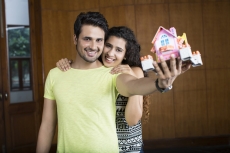 couple posing with home miniature