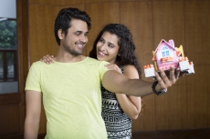 couple posing with home miniature