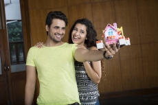 couple posing with home miniature