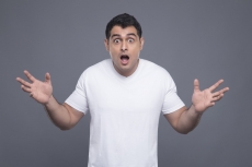 surprised man in white t shirt