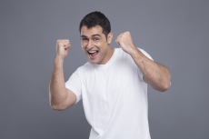 man in white cheering 