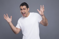 surprised man in white t shirt 