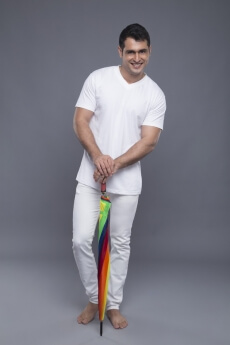 man posing with a colourful umbrella 
