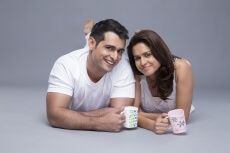 couple lying with front view drinking coffee