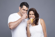 couple drinking orange juice 