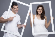 couple looking through the frame 