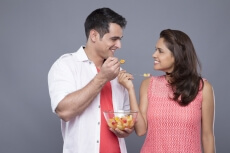 couple eating fresh fruits 
