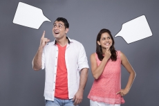 excited couple with thought box 