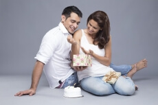 husband giving wife a present on birthday