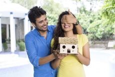 man surprising woman with new home