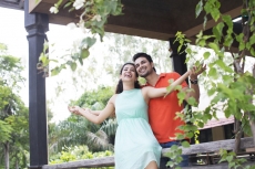 couple enjoying the weather in the balcony