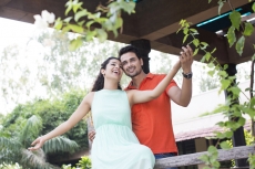 couple enjoying the weather in the balcony
