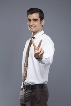 professionally dressed doing victory gesture
