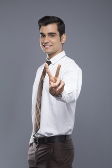 professionally dressed doing victory gesture