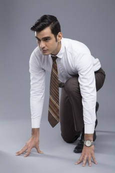 professionally dressed man ready to run