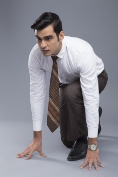 professionally dressed man ready to run