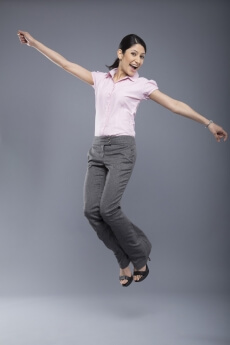 professional woman jumping in the air