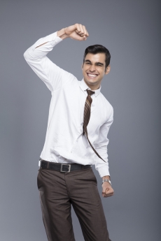 man in formal clothes cheering