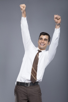 man in formal clothes cheering