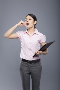 young businesswoman bored and yawning