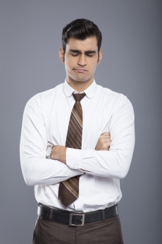 professionally dressed man disappointed 