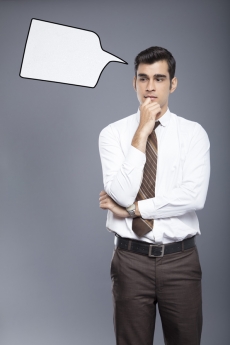 man formally dressed with a thought box 