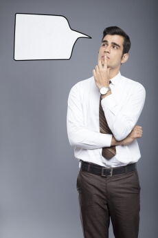 man formally dressed with a thought box 