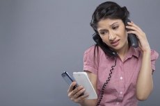 busy woman working and answering a lot of calls at the same time