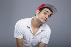 man in casuals posing with cap