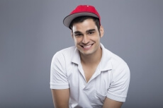 man in casuals posing with cap