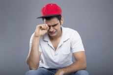 young man sitting and crying