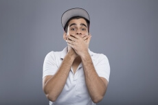 surprised man with hand on mouth