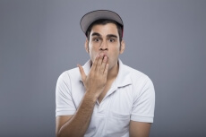 surprised man with hand on mouth