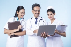 doctors working on laptop 