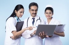 doctors working on laptop 