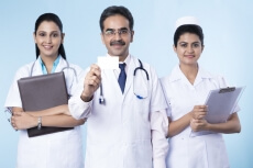 doctor standing with white card 
