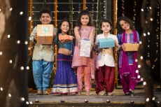 group of kids carrying gifts and presents on diwali