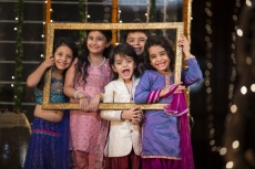 cheerful small group of kids holding a picture frame