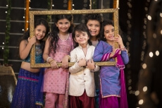 cheerful small group of kids holding a picture frame
