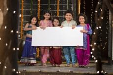 cheerful small group of kids holding a message board