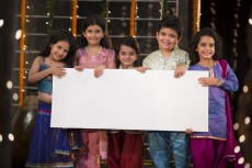 cheerful small group of kids holding a message board